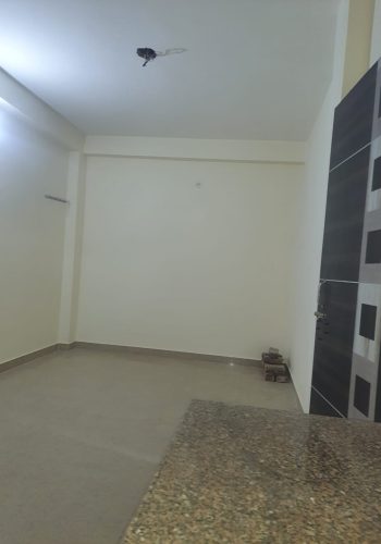 Affordable room for rent in Deoli South Delhi living area.